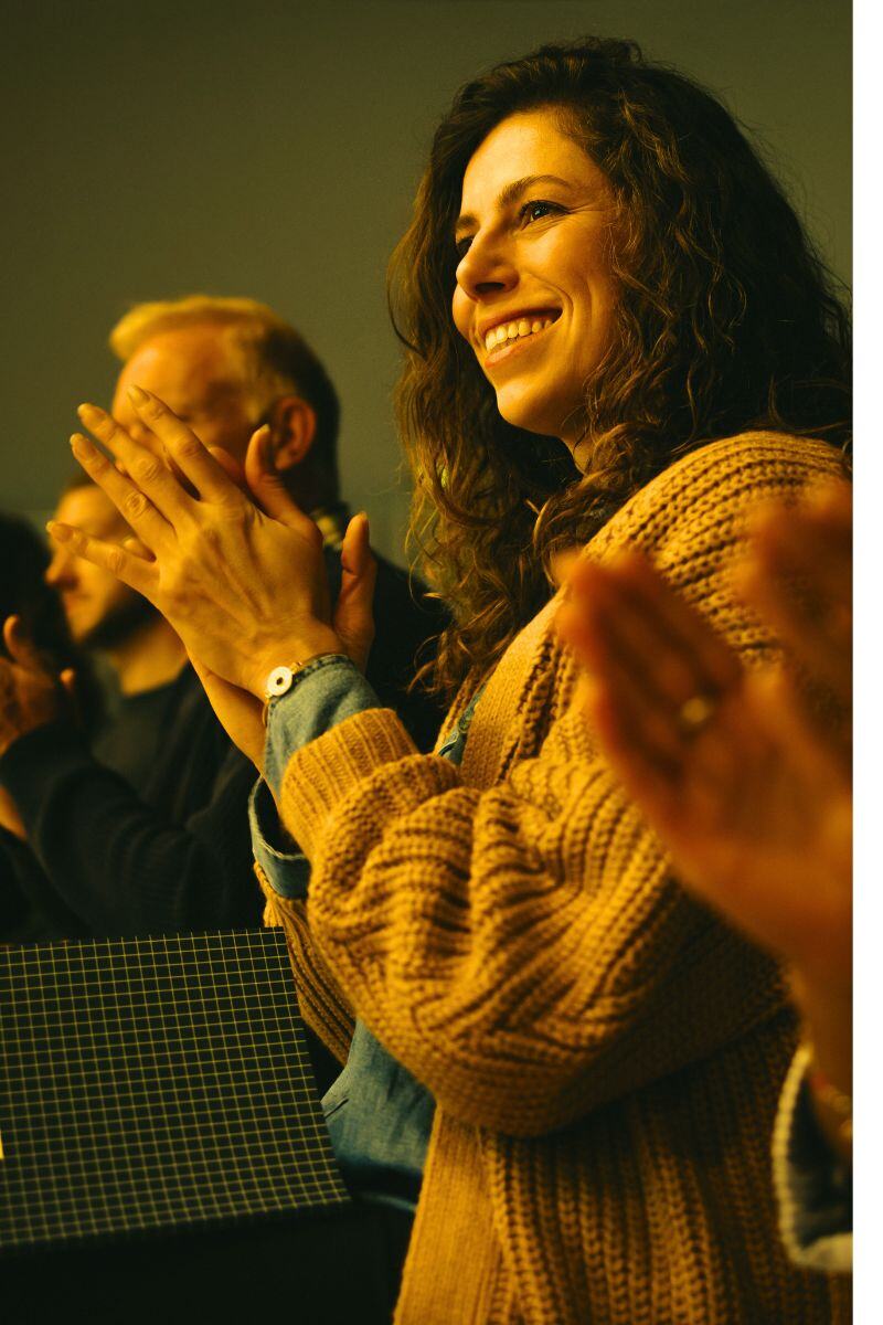 woman clapping in audience - AdobeStock-428951346