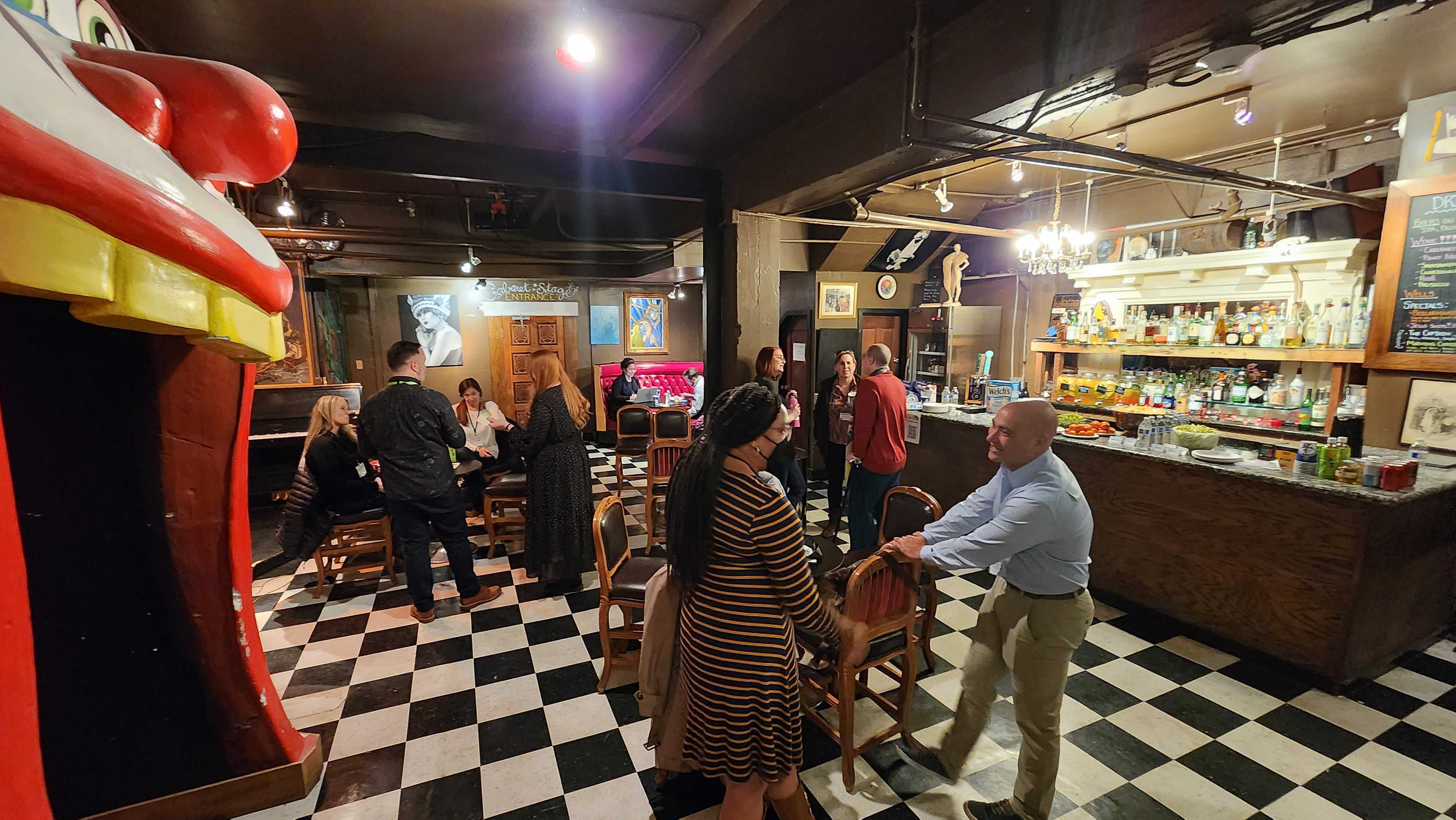 Groups of people converse at Spektrix Hubs San Francisco.